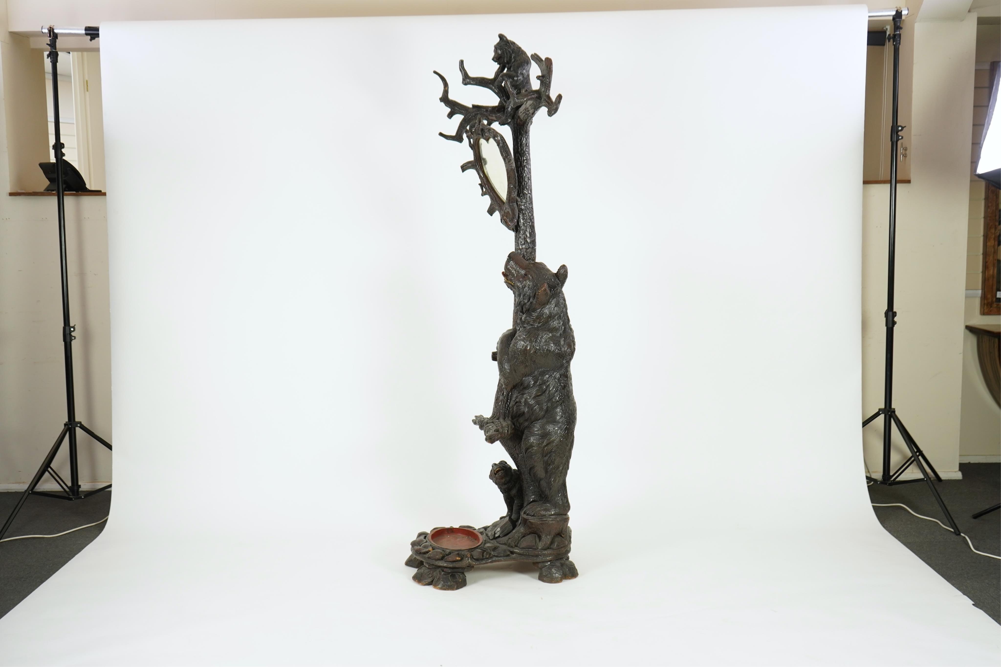 A late 19th century Black forest carved bear hallstand